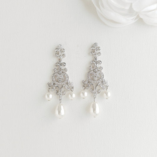 Lightweight silver vintage style pearl drop chandelier earrings featuring cubic zirconia and flawless round crystal pearls.
