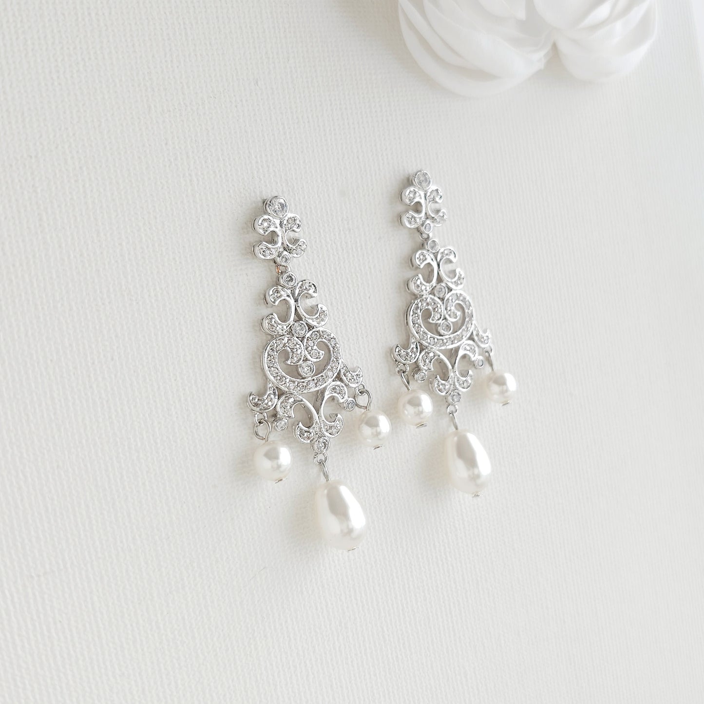 Silver filigree dangle earrings style: with Lightweight silver vintage style pearl drop chandelier earrings featuring cubic zirconia and flawless round crystal pearls.