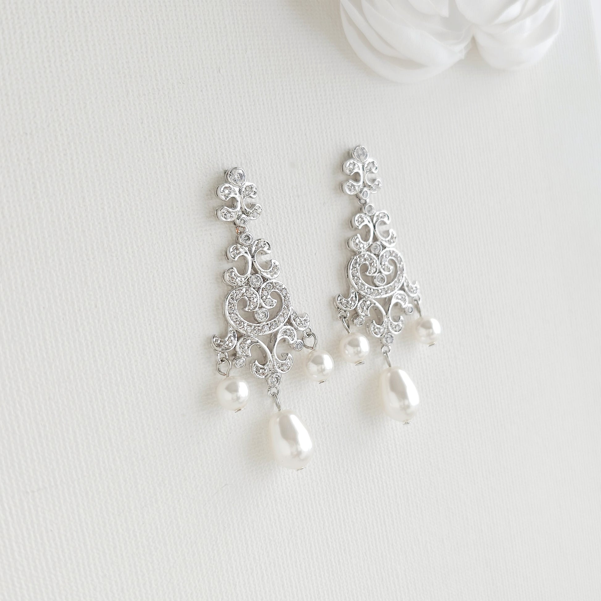Silver filigree dangle earrings style: with Lightweight silver vintage style pearl drop chandelier earrings featuring cubic zirconia and flawless round crystal pearls.