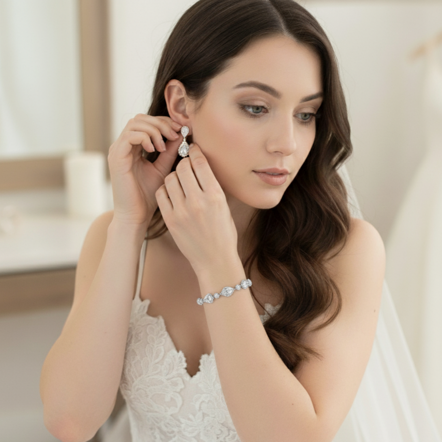 Woman wearing a bracelet and earrings, with a blurred indoor background